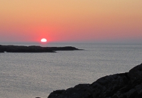The sun setting into the sea from the North Coast of Inishbofin