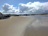 Walking across the sand at low tide to Omey Island